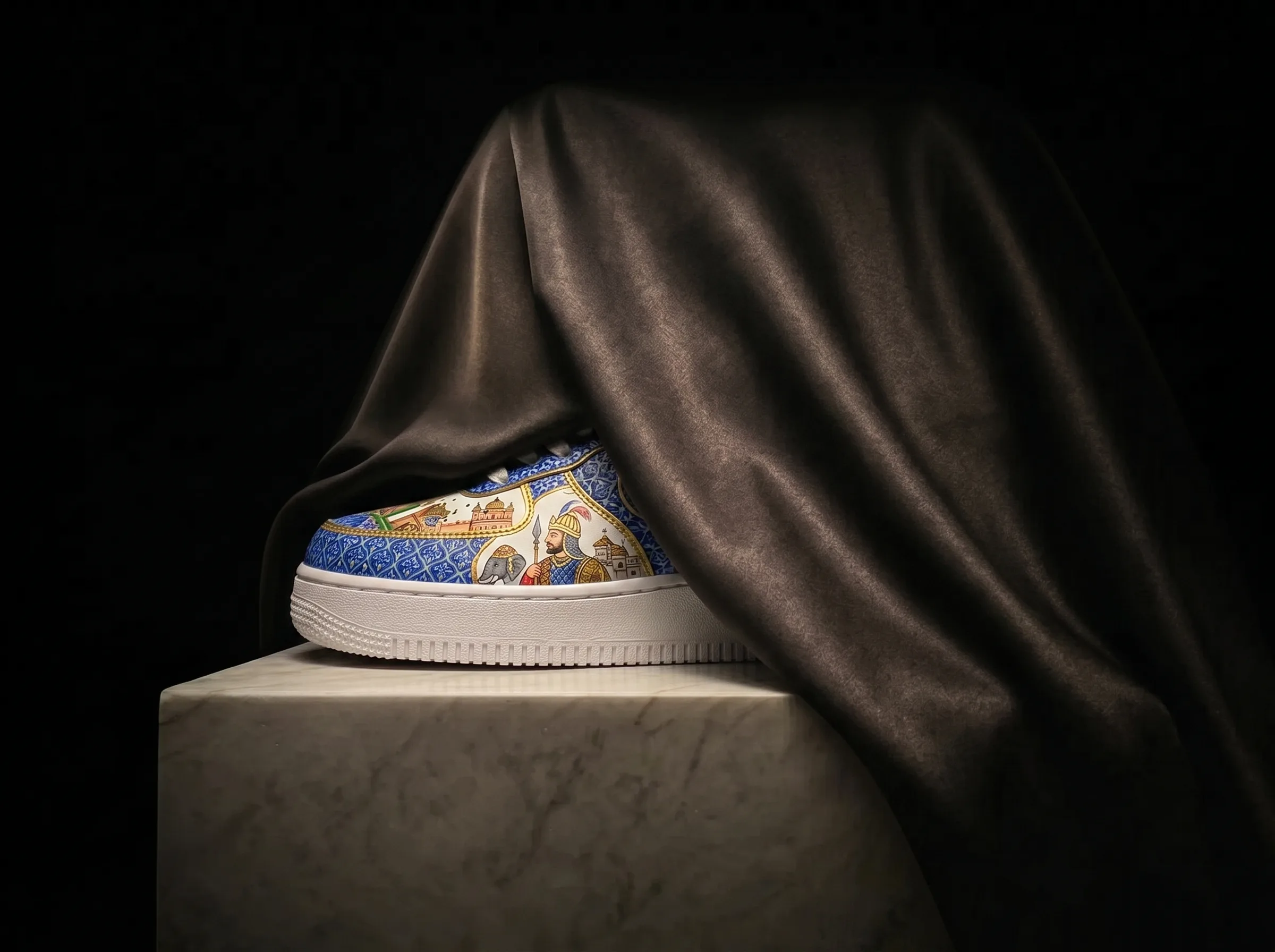 A finished pair on a marble plinth, half-hidden under a black satin veil