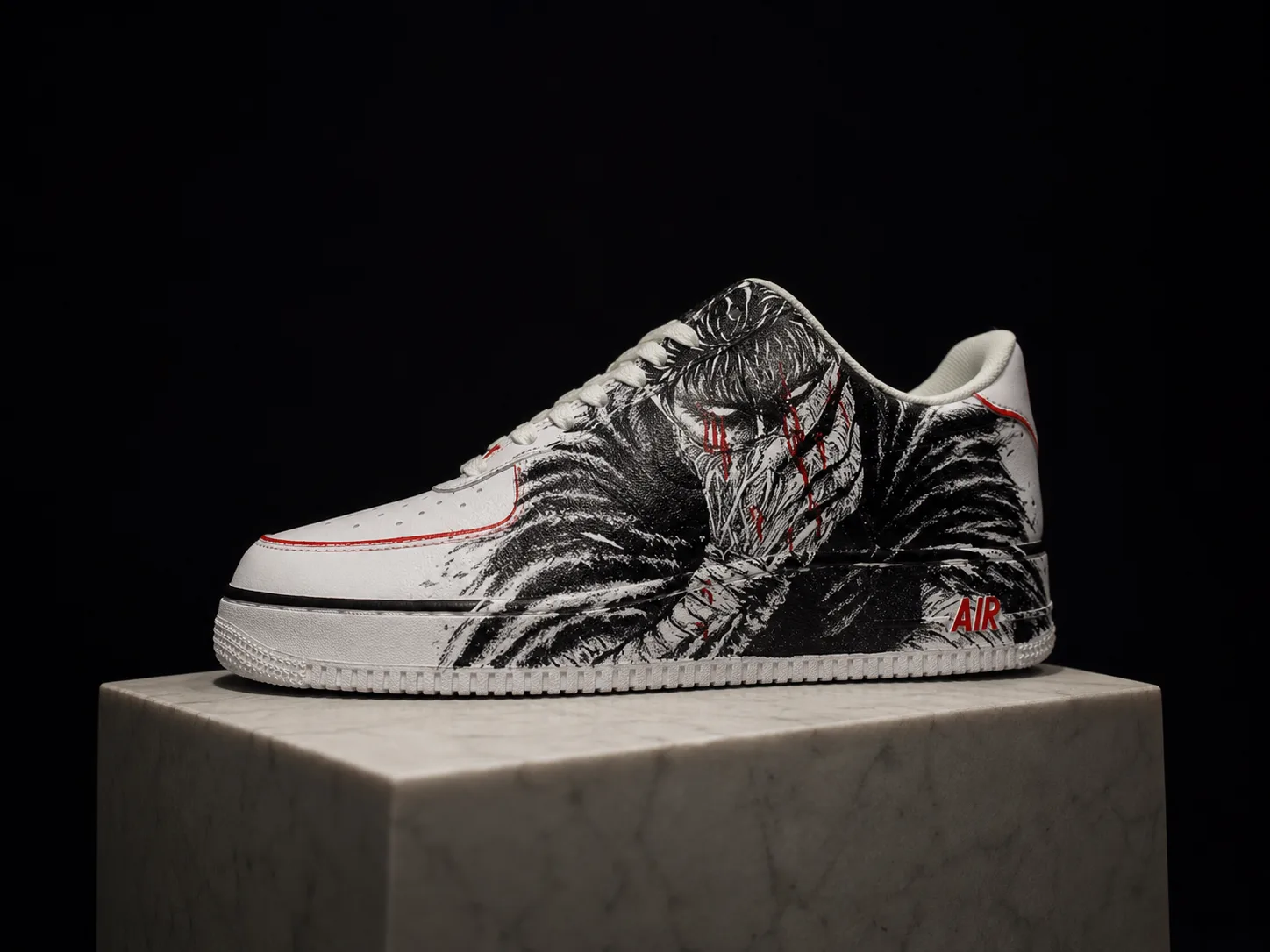 A finished hand-inked pair presented on a marble plinth, ready to leave the atelier