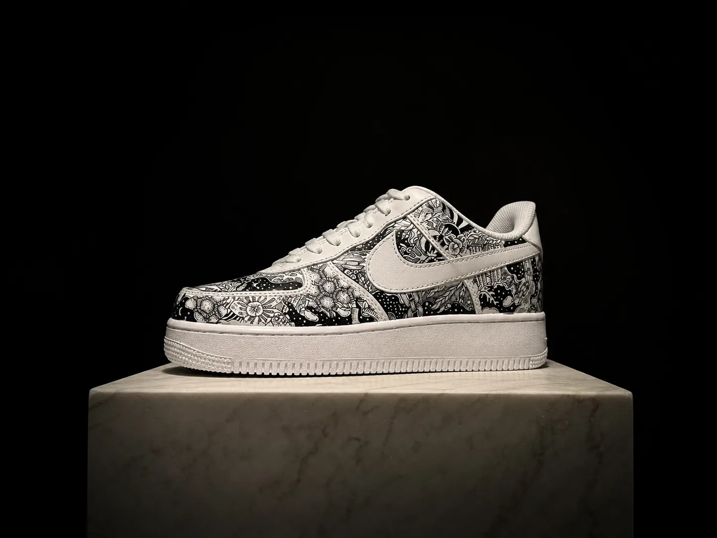A finished hand-painted pair under museum spotlight on a marble plinth